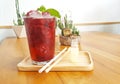 Refreshment iced roselle drink on wodden plate with mint leaf