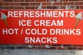 A refreshments sign near the seaside