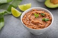 Refried beans in a white bowl