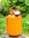 Refrigerant cylinder and hoses with pressure gauge Royalty Free Stock Photo