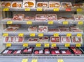 Refrigerated shelf with fresh packaged meat for sale