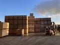 Potato storage facility. Wooden boxes used for potatoes and onions are stacked outside the warehouse. Royalty Free Stock Photo