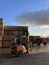 Potato storage facility. Wooden boxes used for potatoes and onions are stacked outside the warehouse.