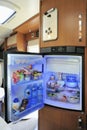 Refrigerator with open door in a camper