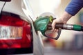 Refuel the car at a gas station fuel pump