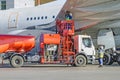 Refueling airplane, aircraft maintenance fuel at the airport. Royalty Free Stock Photo