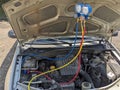 Refueling a car air conditioner with freon