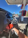 DENVER, CO - September 4, 2022: Refueling a car at Exxon Retail Gas Location. ExxonMobil is the World's Largest Oil