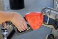 Refueling car fill with petrol gasoline at gas station an petrol pump filling fuel nozzle Royalty Free Stock Photo