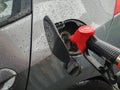 refueling Car fill with petrol gasoline at gas station and petrol pump filling fuel nozzle in fuel tank Royalty Free Stock Photo