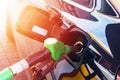 Refuelling the car at a gas station fuel pump. Man driver hand refilling and pumping gasoline oil the car with fuel at he refuel s Royalty Free Stock Photo