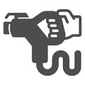Refueling EV charging gun in hand solid icon, electric car concept, gasoline nozzle sign on white background, Human hand Royalty Free Stock Photo