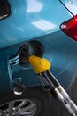 Refueling the fuel tank of the machine with diesel or gasoline at a filling station Royalty Free Stock Photo