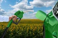 Refuelling car with bio fuel. Carbon neutral transortation Royalty Free Stock Photo