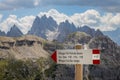 Refuge sign in front of the Three Peaks in the Dolomites Royalty Free Stock Photo