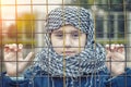 A refugee girl from the east in a headscarf Royalty Free Stock Photo