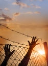 Refugee men and fence Royalty Free Stock Photo