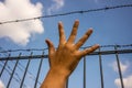 Refugee men hand and fence Royalty Free Stock Photo