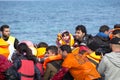 Refugees arriving in Greece in dinghy boat from Turkey. Royalty Free Stock Photo