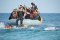 Refugees arriving in Greece in dinghy boat from Turkey. Royalty Free Stock Photo