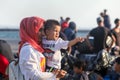 Refugees and migrants disembark to the port of Thessaloniki after being transfered from the refugee camp of Moria, Lesvos island