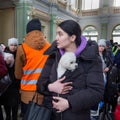 Refugee with pet dog at Przemysl train station near the Ukraine border with Poland