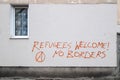 Refugees welcome graffiti in on the wall in Warsaw