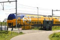 Refurbished doubledeck VIRM intercity train on track heading Rotterdam