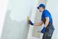 refurbishment. Plasterer worker spackling a wall with putty Royalty Free Stock Photo