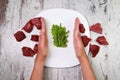 Refusal of meat. Vegetarian`s hands reject pieces of red meat.