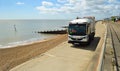 Refuse collection truck on seafront promenade Felixstowe Suffolk England.