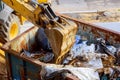 refuse disposal with excavator shovel construction site Royalty Free Stock Photo