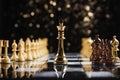 Regal gold chess king faces off against silver adversary strategically