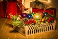 Basket with colorful Christmas balls and pine cones Royalty Free Stock Photo