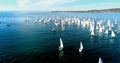 Regatta in Gelendzhik Bay. A lot of small one-and two-person yachts jostle in the Bay with a light wind. The view from