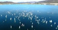 Regatta in Gelendzhik Bay. A lot of small one-and two-person yachts jostle in the Bay with a light wind. The view from