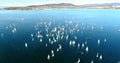 Regatta in Gelendzhik Bay. A lot of small one-and two-person yachts jostle in the Bay with a light wind. The view from