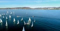 Regatta in Gelendzhik Bay. A lot of small one-and two-person yachts jostle in the Bay with a light wind. The view from