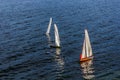 Three model sailing boats on a lake in Austria in winter Royalty Free Stock Photo