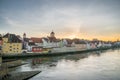 Regensburg in the evening light with the promenade the Cathedral and the stone bridge, Germany Royalty Free Stock Photo