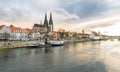 Regensburg in the evening light with the promenade the Cathedral and the stone bridge, Germany Royalty Free Stock Photo