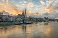 Regensburg in the evening light with the promenade the Cathedral and the stone bridge, Germany Royalty Free Stock Photo