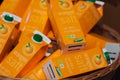 Regensburg, Germany - 2021 02 05: Cartons with orange juice of brand dennree lying in basket on display in organic super market