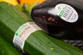 Regensburg, Germany - 03 05 2024: Close up of assortment of organic eggplants and zuchinis with REWE Bio stickers