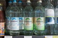 Regensburg, Germany - 2021 02 05: Glass bottles of mineral water of brand Adelholzener on shelf in german organic super market