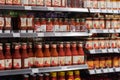Regensburg, Germany - 2021 02 05: Shelves with bottles and glasses of a variety of tomato ketchup from various brands  on display Royalty Free Stock Photo