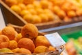 Regensburg, Germany - 2021 02 05: Unpacked organic oranges in basket with price tag on display in organic super market with