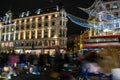 REGENT STREET, LONDON, ENGLAND- 14 November 2021: Long exposure photograph of people Christmas shopping on Regent Street