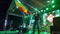 Reggae concert Rasta man waving reggae flag Royalty Free Stock Photo