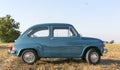 Reggio Emilia Italy : 2023 01 08 example of Vintage old car Fiat 750 in sugar paper blue color on a sunny day Royalty Free Stock Photo